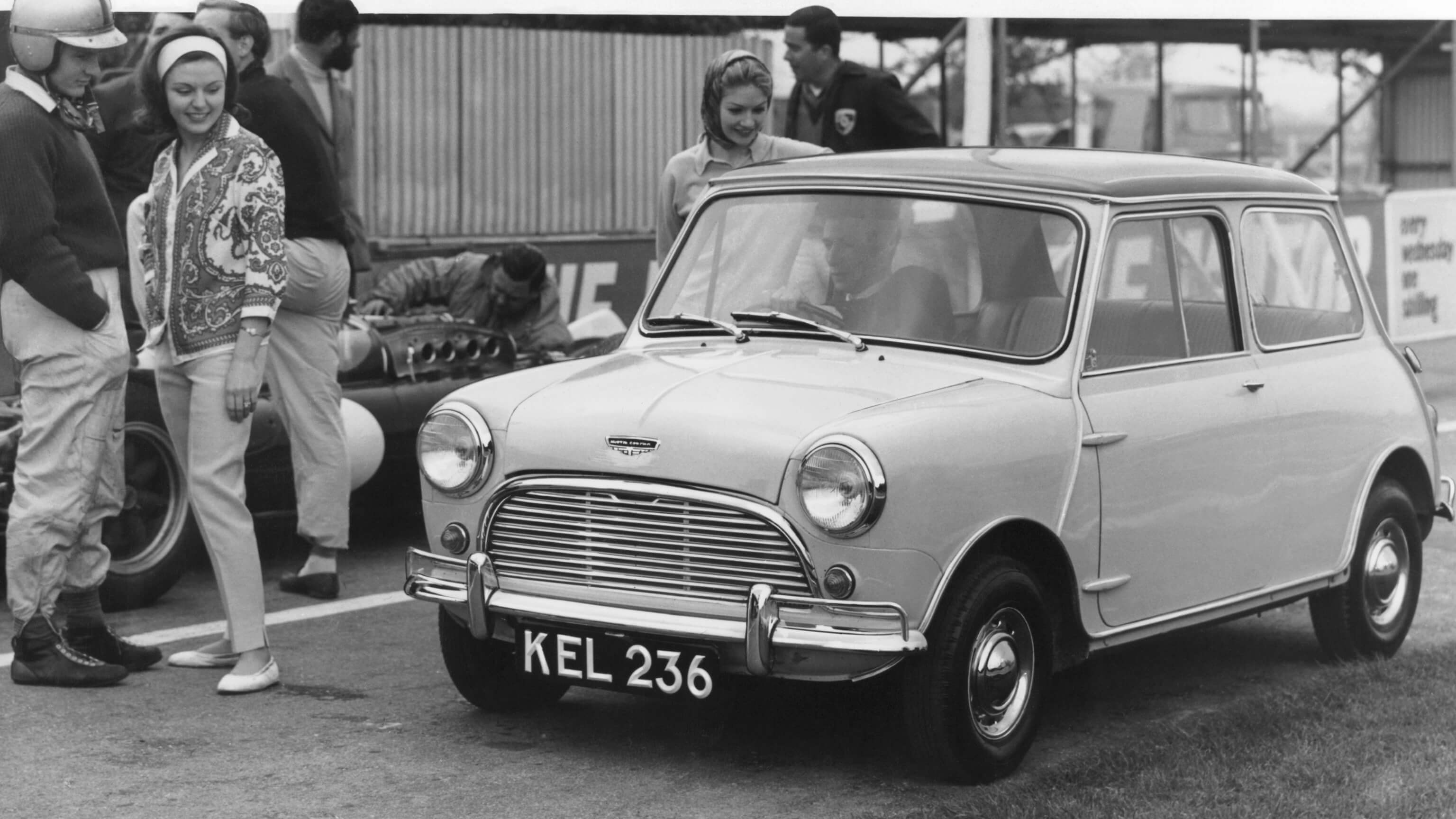 Period photo of an early Mini racer Mk1 trackside.